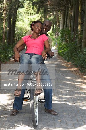 Couple Riding on Bicycle