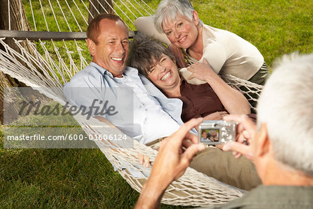 Friends in Hammock Posing for Photograph