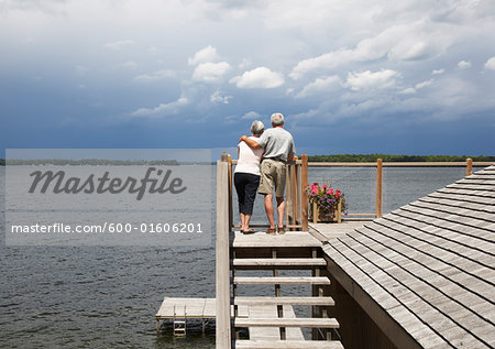 Couple Looking over Lake from Deck