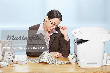 Businesswoman Printing Money