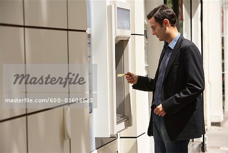 Man Using Bank Machine