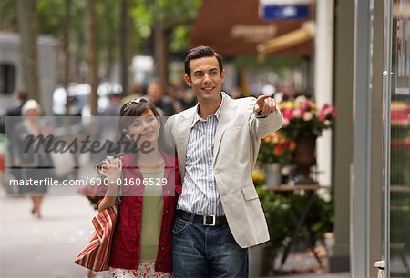 Couple Walking on Sidewalk