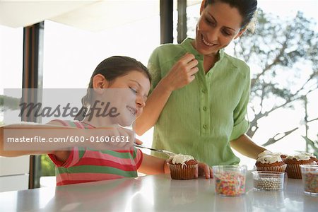 Mother and Daughter Making Cupcakes