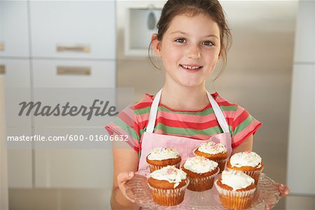 Little Girl Baking Cupcakes