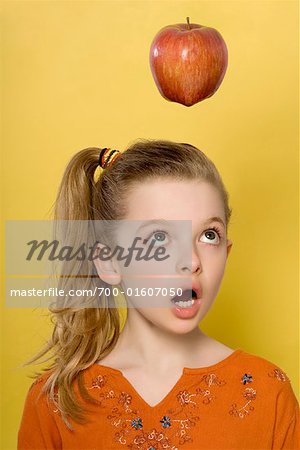Girl Looking at Apple