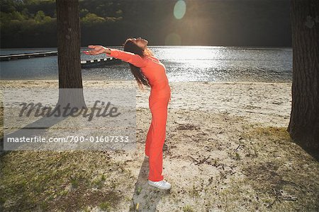 Woman Stretching in Park