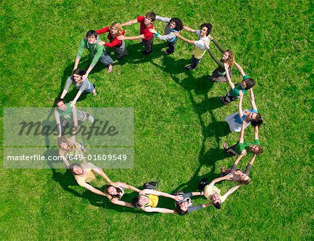 Group standing joined in a circle