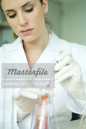 Young woman working in scientific laboratory