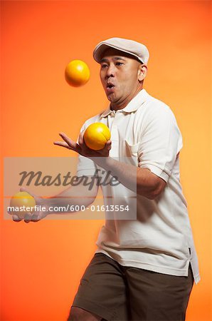 Man Juggling Oranges