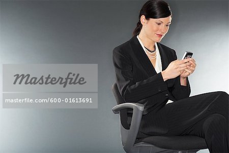 Businesswoman Sending Text Message