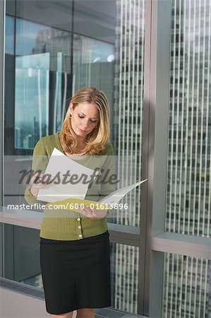 Businesswoman Looking at Documents