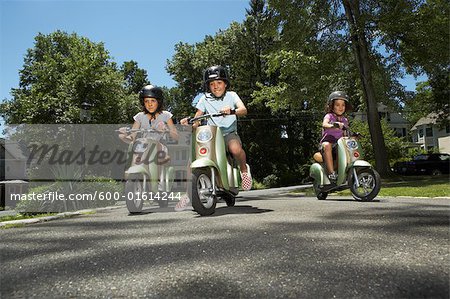 Sisters Riding Scooters
