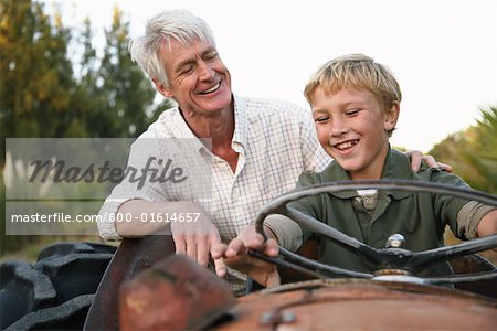 Grandfather and Grandson on Tractor
