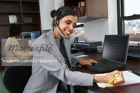 Portrait of businesswoman using laptop