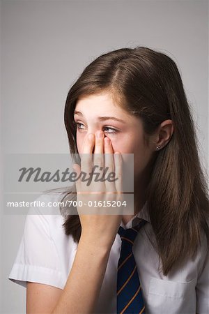 Girl Wiping Tears Off Face