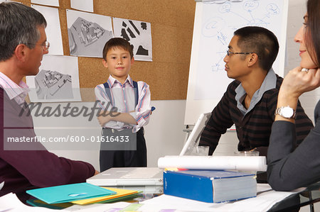 Child Leading Presentation in Office