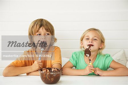 Children With Bowl of Chocolate Sauce