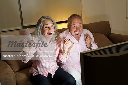 Couple Watching Lottery Draw on Television