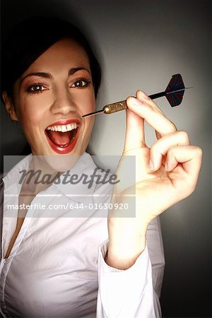 Office worker holding a dart