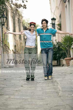 Couple with Greek costume hats dancing