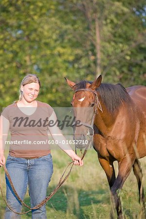 Woman Leading Horse