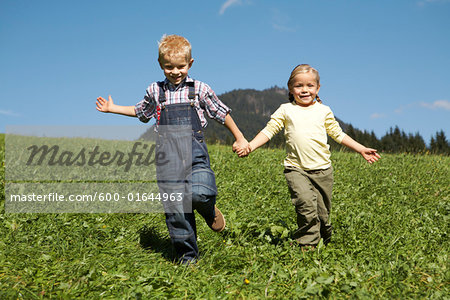 Brother and Sister Running Down Hill