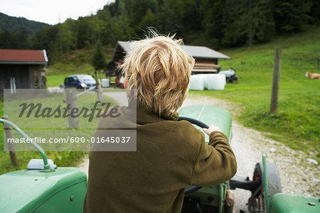 Boy Riding Tractor