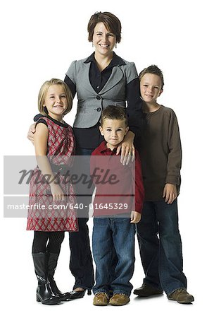 Woman with three children smiling