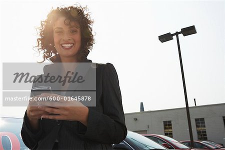 Portrait of Woman in Car Lot