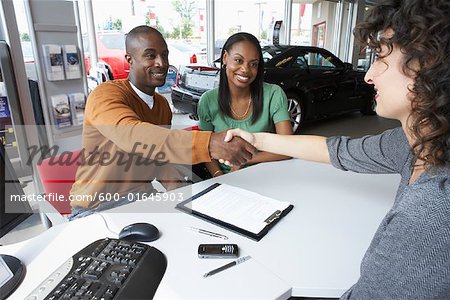 Couple With Car Saleswoman