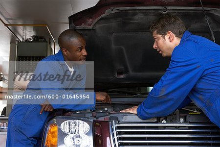 Mechanics Working on Car