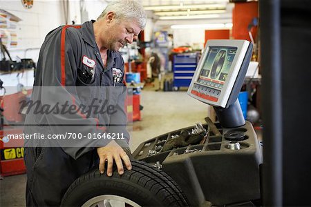 Mechanic Working on Car