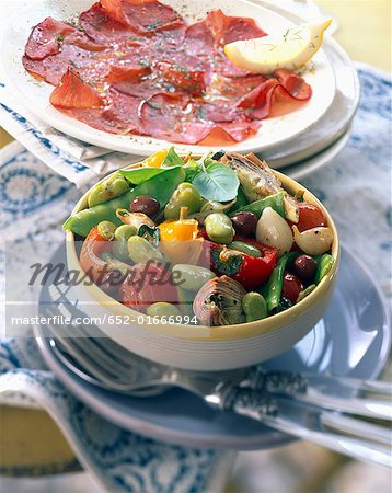 Plate of Bresaola mixed vegetables fried Italian-style