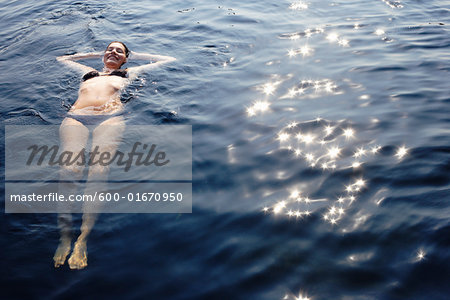 Woman Swimming in Lake