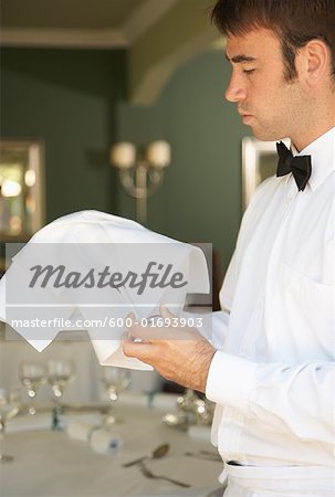Waiter Polishing Glasses