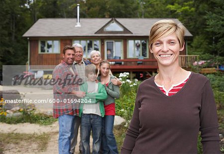 Portrait of Extended Family by Cottage