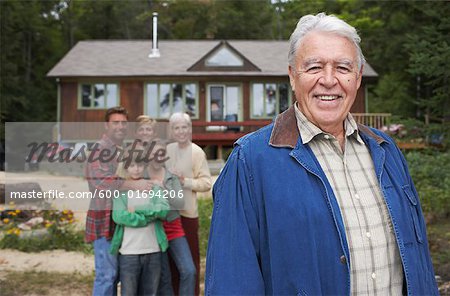 Portrait of Extended Family by Cottage