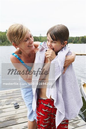 Mother Drying Son off on Dock