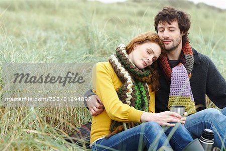 Man and Woman Sitting in Field, Ireland