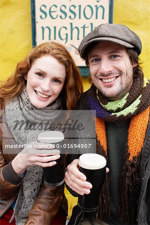 Couple with Beers on Bar Patio, Ireland