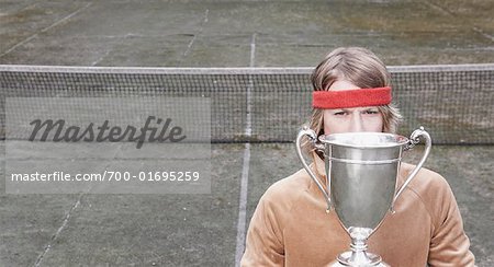 Portrait of Man Holding Trophy