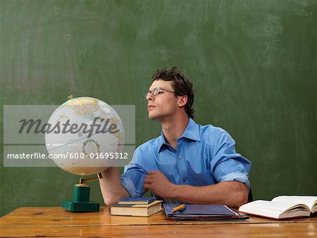 Teacher Looking at Globe