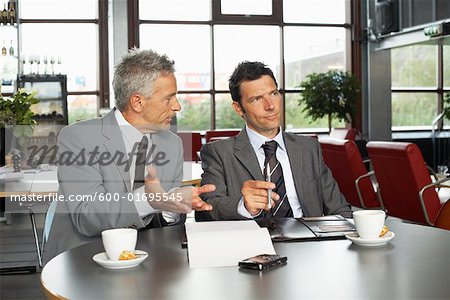 Businessmen Looking at Document