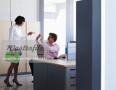 Coworkers Arguing in Office