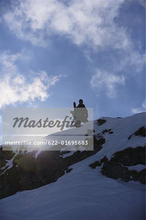 Snowboarder Standing on Mountain