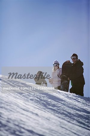 Three Snowboarders