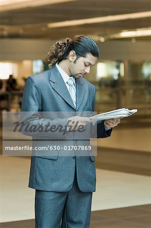 Businessman reading a newspaper