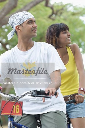Young couple riding a bicycle