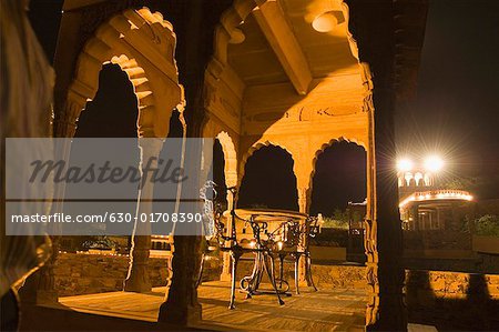 Two iron chairs in a fort at night, Neemrana Fort, Alwar, Rajasthan, India