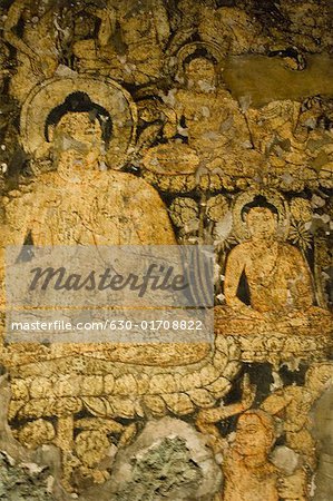 Mural of Buddha on the wall of a cave, Ajanta, Maharashtra, India